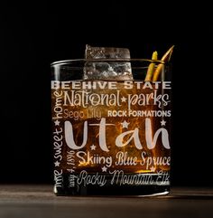 a close up of a drink in a glass on a table with the words utah above it