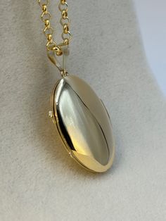 "14k Gold oval locket Necklace about 9.29 gr , 22 \", 3mm Priced to sell! Compare our prices to other similar sellers! Arrives in a GIFT BOX and includes FREE SHIPPING within the USA and Canada. International shipping is available at the most economical rates on ETSY. I HAVE BEEN IN THE JEWELRY BUSINESS ALL MY LIFE. I am a second -generation family member making gold and jewelry. Please feel free to ask me any questions - Always happy to help! Fast Replies to messages! Superior Quality and Best Prices!" Gold Oval Link Locket Necklace For Anniversary, Gold Oval Link Locket Necklace With Polished Finish, Classic Locket Necklace With Charms For Gift, Polished Oval Link Locket Necklace For Gift, Oval Link Locket Necklace With Polished Finish Gift, 14k Gold Locket Necklace With Polished Finish As Gift, Polished Finish Oval Link Locket Necklace For Gift, Gold Polished Keepsake Locket Necklace, Gold Locket Necklace With Charms For Memorial