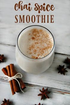 chai spice smoothie in a glass with cinnamon sticks and star anise on the side