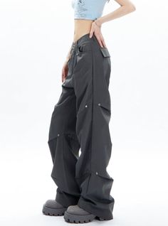 Elevate your wardrobe with our luxurious Charcoal Gray Cargo-Style Wide-Leg Pants. Crafted with a cargo-style design and a wide-leg fit, these pants offer both style and comfort. Perfect for any occasion, these pants are versatile and will add a touch of sophistication to your look. Material Info: Polyester 100% Model info: Height: 165 cm Weight: 45 kg Size worn: M Futuristic Clothing, Grunge Accessories, Work Suits, Casual Wide Leg Pants, Style Wide Leg Pants, Sweatshirt Set, Cargo Trousers, Sweatshirt Dress, Charcoal Gray