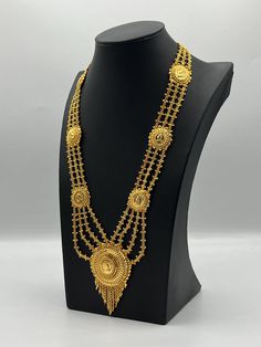 Indulge in the rich heritage of South Asia with our captivating necklace, a dazzling fusion of Indian, Pakistani, and Nepali influences. Inspired by the opulence of traditional jewelry, this exquisite piece showcases intricate craftsmanship and vibrant gemstones, reminiscent of royal adornments from the subcontinent. Embellish your neckline with its enchanting design, meticulously crafted to capture the essence of South Asian splendor. Elevate your style and embrace the cultural tapestry of Indi Heavy Temple Jewelry Necklaces For Eid, Ornate Kundan Filigree Necklaces, Gold Tilla Necklaces For Eid, Gold Temple Jewelry Necklaces For Eid, Heavy Round Bollywood Necklaces, Gold Chandbali Necklaces For Eid, Bollywood Style Festive Filigree Necklace, Gold Necklaces For Eid, Heavy Necklaces For Eid Celebration