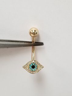 "Thanks for shopping our vintage estate store. We tend to sell well below wholesale and truly hope you enjoy all of our items. Many of the items are one of a kind, so please enjoy scrolling through the pictures and hopefully something will catch your eye. Brown spots are from camera. New 14k yellow gold .10ct cz diamond white blue, black onyx evil eye belly ring. Length: 1\" Width: 10mm 1/2\" Ball: 5mm CZ Diamonds: .15ct Weight: 0.90 gram Shank thickness: 1.5mm 14 gauge Very sweet. Marked 14k." Belly Ring Piercing, Evil Eye Blue, Bellybutton Piercings, Belly Piercing Ring, Ring Piercing, Diamond Evil Eye, Belly Piercing, Belly Ring, Brown Spots