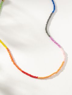 Transition your look into summer with our Color Block Beaded Necklace. Featuring green, yellow, orange, red, peach, pink, purple, gray, and blue beads, this necklace really has it all. For a full vacation-approved look, pair this colorful necklace with anything from our beaded jewelry collection. Fun Multicolor Beaded Necklace, Retro Multicolor Beaded Necklace, Playful Multicolor Beaded Chain Necklace, Playful Multicolor Beaded Necklace, Multicolor Polished Bead Choker, Uncommon James, Colorful Necklace, Red Peach, Purple Gray