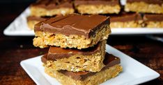 three pieces of chocolate peanut butter bars stacked on top of each other