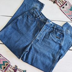 RARE 80s Vintage Rockies cowboy jeans     - Slightly faded medium wash blue non stretch denim     - High waisted     - Straight leg     - Bareback (no back pockets)     - Western seaming details      RETURNS ARE NOT ACCEPTED, PLEASE REFER TO THE MEASUREMENTS CAREFULLY  Modern day size 31 waist Large...labeled size 15/16...vintage sizes run differently from modern     Waist: 15.5"     Hip: 24.5"     Rise: 13.5"     Inseam: 35.5" (long inseam) measurements are taken with the garment laying flat  Condition: Color has faded a bit, with mild whiskering. the hem has some scuffing...can be rolled up to disguise. the fading of the jeans adds to the charm!  100% Cotton ⚡️Instagram, TikTok and Facebook: @sangre.de.cristo.vintage⚡️ made in the USA 🇺🇸  rockies, lawman, western ethics, roughrider, ro 90s Style Wide Leg Medium Wash Jeans, Retro Faded Denim Bottoms, Faded Retro Denim Bottoms, Retro High Rise Medium Wash Jeans, 90s High Rise Rigid Denim Jeans, Vintage Medium Wash Denim Jeans, 90s Style Medium Wash Full Length Pants, 90s High-rise Rigid Denim Jeans, 90s Style High Rise Medium Wash Pants