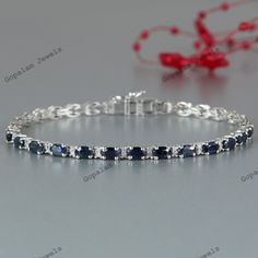 Blue Sapphire Tennis Bracelet-925 Sterling Silver Bracelet-September Birthstone-Diamond Bracelet-14k Gold Bracelet-Wedding Gift for Her-Anniversary Gift-Gift for Wife-Sapphire Jewelry ★ PRODUCT DETAILS ★ * SKU:- BST-514-BS-D3 * Product:- Bracelet * Metal:- Can Choose from Variations (Gold & Sterling Silver) Available * Metal Purity:- Can Choose from Variations (14k Gold & 925 Silver) Available * Bracelet Weight:- 9.62 Gms (Approx.) ★ STONE DETAILS ★ * Stone Name:- Blue Sapphire * Stone Size:- 5x Sterling Silver Gemstone Bracelet For Anniversary, Sapphire Bracelets With Prong Setting For Anniversary, Anniversary Gemstone Sterling Silver Bracelet, Classic Sapphire Tennis Bracelet For Anniversary, White Gold Sapphire Bracelet As Gift, Sapphire Bracelets For Wedding, Classic Sapphire Bracelets For Anniversary, White Gold Sapphire Tennis Bracelet For Wedding, Classic Sapphire Diamond Bracelet For Anniversary