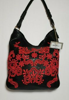 NWT ISABELLA FIORE VICTORIAN FEEL EMBROIDERED RED AND BLACK LARGE HOBO EMBROIDERED STUDDED SHOPPER TOTE $425 BRAND NEW WITH TAGS IS A STUNNINGLY BEAUTIFUL DESIGNER HOBO BAG. ISABELLA FIORE VICTORIA TOTE, RED EMBROIDERY ON A BLACK BASE,THIS SATIN HANDWHIP STICHED TOP RIM . LARGE MAGNETIC CLOSE REAR POCKET BRASS HARDWEAR ACCENTS 2 INSIDE POUCHS AND ZIPPERED SIDEWALL COMPARTMENT. MEASURES APPROX. 12” HIGH x 12” ACROSS x 4” DEEP AND APPROX 11” SHOULDER STRAP DROP. 13 WITH SLOUCH CONDITION IS NEW WIT Designer Embroidered Top Handle Bag, Designer Shoulder Bag For Summer Shopping, Designer Summer Shoulder Bag For Shopping, Elegant Leather Hobo Bag For Spring, Elegant Spring Hobo Bag For Shopping, Designer Leather Summer Bags, Designer Embroidered Tote Bag, Designer Leather Bags For Summer, Designer Embroidered Bags For Shopping