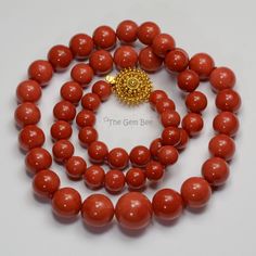 DESCRIPTION: Thank you for coming in! Spectacular 18K solid gold necklace with Mediterranean Sardinia Coral sphere beads, no dye, 100% natural tomato red color. 9.5mm-17.15mm large coral beads, 128 grams with a beautiful 18k solid gold clasp~Our favorite color for coral! The beads are premium quality, you do not find hairline cracks which are common with Mediterranean coral beads. Accompanied with GIA report number 2191866911 to assure your investment! You'll get the necklace you see! SIZE of co Formal Single Strand Red Coral Necklace, Elegant Orange Hand-strung Necklace, Elegant Red Coral Jewelry With 8mm Beads, Elegant Red Coral Necklaces With Polished Beads, Yellow Gold Polished Beads Necklaces, Yellow Gold Necklaces With Polished Beads, Formal Round Polished Beads Necklace, Formal Round Necklace With Polished Beads, Elegant Orange Jewelry With 8mm Beads