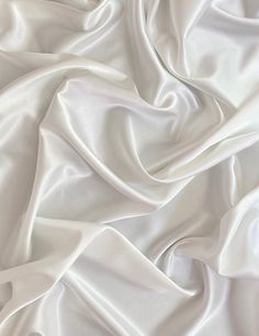 "Love this silk! It is great quality and sees well. It was my first time sewing with it and I had no problems. Color was very accurate, as shown in the pictures!" Sue A., Verified Kikitextiles Customer ✅ Our satin fabric is a very smooth, light fabric with an exquisite drape along with a lovely sheen. Each event will be a special one, because our satin is smooth to the touch, has a natural shine and it drapes well, feels wonderful on your skin. You only have to shine and to feel as light as our Fabric Background Photoshoot, Silk Texture Fabric, White Cloth Background, First Time Sewing, White Silk Fabric, White Satin Fabric, Midnight Masquerade, Satin Texture, Silk Sheets