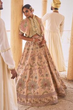 Beige and pink can can attached lehenga with cutdana embellished floral jaal embroidered motifs. Comes with padded embellished blouse and embellished gillet. - Aza Fashions Traditional Drape Lehenga For Wedding, Traditional Wedding Lehenga, Transitional Lehenga With Dupatta, Embroidered Sharara For Reception, Festival Gown For Reception, Transitional Designer Gown, Festive Embroidered Fabric For Wedding, Semi-stitched Embellished Lehenga For Transitional Season, Zari Work Embroidered Fabric For Reception