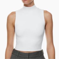 This Is A Mockneck Tank Top With A Body-Hugging Fit. It's Made With Babaton's Signature Contour Luxe, Ultra-Flattering Fabric Coveted For Its Smoothing Effect And Second-Skin Feel. Essential For Every Body. Size M New With Tag Elegant Fitted Crew Neck Crop Top, White Stretch Tops With Funnel Neck, Casual Stretch Mock Neck Cropped Top, Casual Stretch Cropped Mock Neck Top, White Fitted Funnel Neck Top, White Trendy Turtleneck Top, Trendy White Turtleneck Top, High Stretch High Neck Spring Tank Top, High Stretch Funnel Neck Top, Trendy Style