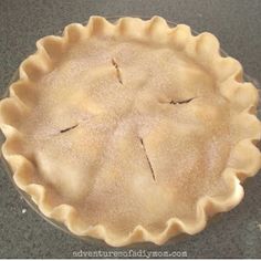 an uncooked pie sitting on top of a counter