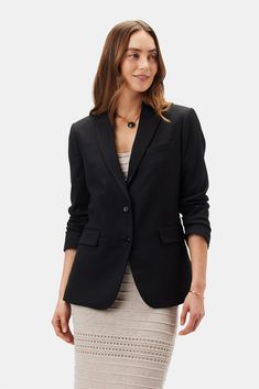 Tobie, a slim-cut, lightweight blazer with tailored suiting details, is an essential foundation piece for a modern working wardrobe. Tailored blazer with notched lapel, welt pockets, and urea buttons Slim fit 67% Recycled Polyester, 26% (FSC) Viscose, 6% Linen 1% Spandex 100% Recycled Polyester lining 27 1/2" in length Runs narrow through the sleeve. Size up for a roomier fit Ethically Made in India Part of a matching set Working Wardrobe, Lightweight Blazer, Foundation Piecing, Tailored Blazer, Linen Blazer, Black Blazers, Welt Pocket, Welt Pockets, Linen Blend