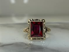 10kt yellow gold ring set with a 9.5x7.5mm synthetic Ruby! Weighs 2.0dwt, is 13.7mm at its widest point and is currently a size 6.25 but can be resized! Vintage Ruby Engagement Ring, Red Sapphire Ring, Ruby Jewelry Ring, Ruby Stone Ring, Vintage Ruby Ring, Antique Ruby Ring, Vintage Gold Ring, Ruby Ring Vintage, Diamond Pendants Designs