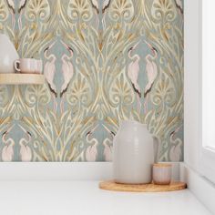 the wallpaper in this kitchen is designed to look like an art deco design with flamingos on it