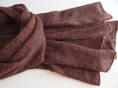 Knitted alpaca scarf of cherry-brown colour with melange effect. The yarn I used is mix of alpaca, merino wool, viscose  and polyamide, scarf is not thick and very soft. This knitted scarf is a perfect accessory for autumn, you can throw it over your shoulders or wrap it around your neck. It also can be a great gift for any occasion. Ready to ship. Measurements: 185 cm / 72.83" - long 55 cm / 21.65" - width Yarn (Italy) - alpaca, merino wool, viscose, polyamide  Made in a smoke free environment. Wing Scarf, Turquoise Scarf, Festival Scarves, Tartan Plaid Scarf, Personalized Scarves, Burgundy Scarf, Scarf Knitted, Rainbow Scarf, Alpaca Scarf