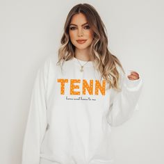 This adorable sweatshirt comes in black and sand sweatshirt colors. This cozy sweatshirt is great for college students, Tennessee Sports fans, Tennessee gift, Tennessee Travel Gift, Game Day Outfit, Tennessee Sports Gift, and Fall Outfits, and more! Ideal for any Tennessee Fan, a unisex heavy blend crewneck Tennessee Home Sweet Home to Me sweatshirt is pure comfort. These garments are made from polyester and cotton. This combination helps designs come out looking fresh and beautiful. The collar College Game Day Outfit Football, Tennessee Sweatshirt, Gameday Fits, Tennessee Shirt, Sweatshirt Colors, Tennessee Travel, College Game Days, Game Day Outfit, Gameday Outfit