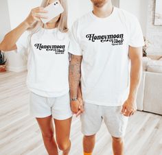 These fun Honeymoon Vibes shirts are the perfect way to celebrate any newly wed couple on their honeymoon! Designed with a fun retro font they are completely customized and a great way to add some fun to the trip! Simply choose the color and size that you want, then fill out the personalization box with the honeymoon location and the color of ink that you would like for each shirt.   You will receive a customized mockup from me within 24 hours of purchase.  If you would like to explore other options for shirt colors simply reach out, I have access to the entire Color Comforts catalog! The soft-washed, Color Comforts garment-dyed fabric brings extra coziness to your wardrobe while the relaxed fit makes it an excellent daily choice. The double-needle stitching throughout the tee makes it hig Honeymoon Shirts Matching, Just Married Shirts, Honeymoon Vibes, Vacation Luxury, Married Shirt, Honeymoon Locations, Honeymoon Shirts, Beach Honeymoon, Newly Wed