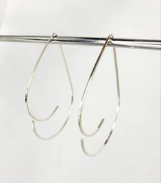 Modern Hypoallergenic Teardrop Jewelry, Hypoallergenic Teardrop Hoop Earrings In White Gold, Silver Teardrop Wrap Earrings, Minimalist Teardrop Metal Hoop Earrings, Minimalist Metal Teardrop Hoop Earrings, Minimalist Metal Teardrop Earrings, Modern Sterling Silver Threader Earrings, Minimalist Teardrop Hoop Earrings With Ear Wire, Minimalist Silver Pierced Teardrop Earrings