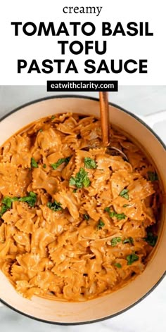 creamy tomato basil tofu pasta in a skillet with text overlay that reads creamy tomato basil tofu pasta sauce