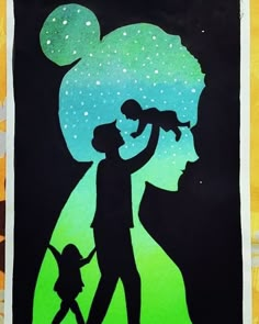 the silhouette of a man holding a child in his arms, against a background of stars