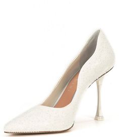 a pair of white high heels on a white background