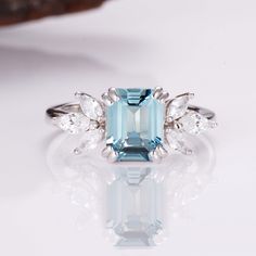 The gentle light blue color of our stunning, hand-chosen aquamarine is the perfect compliment to our gorgeous Ivy ring design. Each ring is made from premium sterling silver to add a little luxury and charm; meanwhile, we’ve included six gorgeous crystals to help every ring shine on any occasion. The perfect design to give your wardrobe a boost! ✦ DETAILS ✦✧ Handcrafted ✧ 2.0 Carat center stone✧ Aquamarine and crystals ✧ Sizes 3.75-11.25✧ This ring will arrive ready to gift in a Kherish Jewelry Aquamarine Ring Rose Gold, Ivy Ring, Timeless Ring, Opal Ring Gold, London Blue Topaz Ring, Aquamarine Ring, Ring Rose Gold, Aquamarine Rings, Quartz Ring