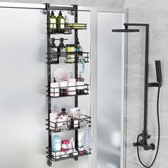 a bathroom with a shower head and shelves on the wall