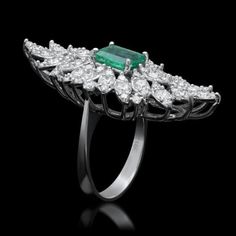 5.35 Carats Natural Emerald and Diamond 14K Solid White Gold Ring Total Natural Green Emerald Weight is: Approx. 2.10 Carats Emerald Measures: Approx. 8.00 x 6.00mm Natural Round Diamonds Weight: Approx. 3.25 Carats (color G-H / Clarity SI1-SI2) Ring total weight: Approx. 7.8 grams Disclaimer: all weights, measurements and colors are approximate and may vary slightly from the listed dimensions or as seen in the image. All pictures are magnified to show the smallest of details. Please, refer to t Luxury Marquise Multi-stone Diamond Ring, Luxury Marquise Emerald Ring, Gia Certified Classic Evening Jewelry, Exquisite Multi-stone Diamond Ring In Platinum, Luxury 14k White Gold Diamond Ring With 17 Jewels, Luxury Marquise Emerald Ring With Diamonds, Exquisite Multi-stone Platinum Diamond Ring, Luxury Marquise Emerald Ring With Prong Setting, Luxury Hallmarked Emerald Ring With Diamond