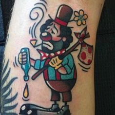 a man with a tattoo on his leg holding a knife and an egg in the other hand