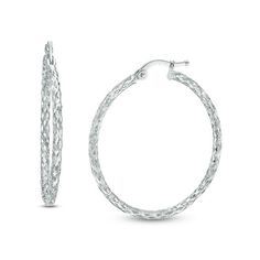 A beautiful addition to her business or casual attire, these sparkling fashion hoop earrings redefine stylish sophistication. Enchanting in cool 14K white gold, each 31.0 x 33.0mm textured hoop showcases breathtaking diamond-cut details that catch and reflect light, creating a look she won't be able to resist. Buffed to a brilliant luster, these earrings secure with latch backs. Zales Zales, Popular Jewelry, Celtic Jewelry, Casual Attire, White Metal, Earring Backs, Christmas Sale, Diamond Cut, Designer Earrings