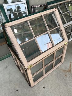 an old window is sitting on the ground