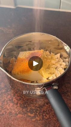 a pan filled with food sitting on top of a counter