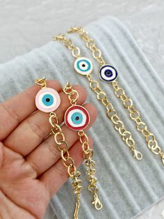 G O L D ∙ L I N K ∙ C H A I N ∙ E V I L  E Y E ∙ B R A C E L E T Evil Eye Bracelet, Enamel Evil Eye Beads, Birthday Gift for Her, Gold Link Chain Bracelet, Greek Evil Eye Jewelry, Red Pink Evil Eye ♥ It is a gold cuban chain bracelets which are the most unique jewelry you can find with charm. ♥ These Evil Eye Bracelets are perfect gift for you and your loved ones.  ♥  Please choose evil eye colors during checkout  ♥ Material: High quality stainless steel with plated  ♥ All our evil eye jewelries Hypoallergenic Chain Bracelet With Round Beads As Gift, Hypoallergenic Round Beads Chain Bracelet As Gift, Multicolor Round Bracelets As Gift, Multicolor Round Bracelets For Gifts, Multicolor Evil Eye Bangle Bracelet Gift, Multicolor Charm Bracelet As A Gift, Pink Bracelet With Adjustable Chain As Gift, Pink Bracelet With Adjustable Chain For Gift, Nickel Free Circular Bracelets For Gift