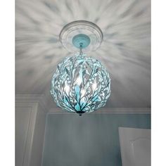 a light that is hanging from the ceiling in a room with white walls and ceilings