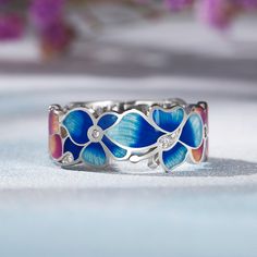 Blue flowers! How inspiring, unique, and elegant. This blue flower ring with silver details is intricately created, giving a realistic effect of the flower's beauty. At the same time, the subtlety and clarity of the enamel capture all the freshness and purity of the wildflowers. A romantic ring that has a flattering fit to a women's hand.Weight: 3.99 gMaterial: Plating Color: Romantic Rings, Flower Beauty, Flower Ring, Blue Flower, The Flowers, Quality Jewelry, Watch Design, Earring Necklace, Blue Flowers