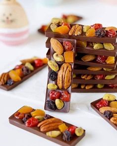 several pieces of chocolate with nuts and dried fruit