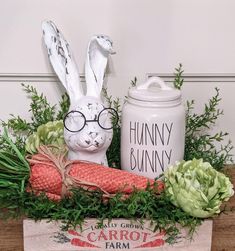 a wooden crate filled with vegetables and an easter bunny