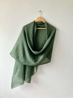 This Dark Green Shawl is a handmade luxury wrap perfect for formal events, serving as an elegant statement piece and wedding guest accessory. Crafted as a versatile cocktail party knit and evening wear cover-up, this shawl combines sophistication with practicality, making it an ideal choice for various special occasions. Luxurious Handmade Dark Green Shawl: Your Essential Formal Event Accessory - Handcrafted using fine mohair and silk blend yarn for a soft, lightweight texture that offers both warmth and style - Available in two sizes: regular (78x18 inches) and oversized (102x25 inches) to suit your preference and outfit - Versatile accessory suitable for weddings, evening parties, proms, cocktail events, and other formal or semi-formal occasions - Timeless dark green color provides a ric Luxury Wrap, Shawl For Wedding, Wedding Guest Accessories, Green Shawl, Dark Green Color, Wedding Shawl, Shawls And Wraps, Formal Occasion, Evening Wear