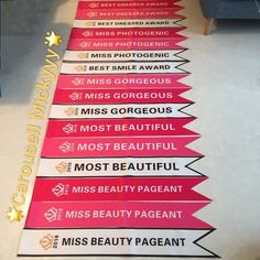 this is a long line of pink and white signs that say miss gorgeous, miss gorgeous, miss beautiful, miss beauty pageant