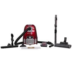 a red and black vacuum is next to some cleaning supplies on a white background,