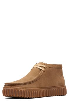 A rib-debossed bumper sole adds rugged detail to a supple suede boot that takes after the iconic Wallabee style with heritage details like skilful topstitching. Removable, cushioned insole with arch support Leather upper and lining/rubber sole Imported Chukka Boots Men, Chukka Boot, Clarks Originals, Suede Boots, Chukka Boots, Arch Support, Rubber Sole, Leather Upper, Arch