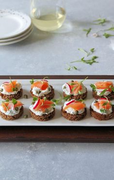 small appetizers are arranged on a white plate