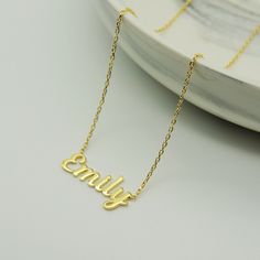 "14k Gold Name Necklace * Custom Name Necklace * Material : 14k Solid Gold - 8k Solid Gold * Finish : White Gold - Yellow Gold - Rose Gold * Production Method : Laser and handmade processes * Lenght: Adjustable Between 14 inch - 22 inch *Lowercase Height : 5 mm A Necklace that your neck will seriously loveee. This name necklace is perfect for everyday. * 100% Handmade for your size * All jewelry comes in beautiful packaging, gift ready. * All items are made to order in Turkey. * Our current proc 14k Gold Tarnish-resistant Nameplate Necklace, Minimalist Yellow Gold Name Necklace As Gift For Her, 14k Gold Name Necklace For Her, Minimalist Yellow Gold Name Necklace For Her, Minimalist Yellow Gold Name Necklace Gift, Gold Nameplate Necklace With Delicate Chain, 14k Gold Tarnish Resistant Name Pendant Necklace, 14k Gold Tarnish Resistant Nameplate Necklace, Minimalist Sterling Silver Tarnish-resistant Name Necklace