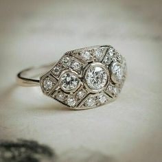 an antique diamond ring on a table