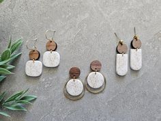 Round walnut wood with sand leaf print on white polymer clay earrings. All handmade with hypoallergenic lead and nickel free brass. Earrings are lightweight make it easy to wear and comfortable. Do to the handmade each pair will be slightly different from listed photos. Because it's handmade please handle with care. May break if bent or dropped. *Please note that brass can tarnish over time if exposed to water,oil,makeup or sunscreen from skin but can be cleaned with jewelry cloth or tarnish rem White Hypoallergenic Nature-inspired Earrings, Hypoallergenic White Nature-inspired Earrings, Nature-inspired Hypoallergenic White Earrings, Nature-inspired Nickel Free White Earrings, Earthy Everyday White Jewelry, White Earthy Everyday Jewelry, White Polymer Clay Earrings, White Polymer Clay, Tarnish Remover