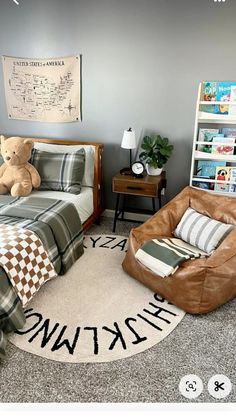 a bedroom with two beds, a chair and a teddy bear on the rug in it