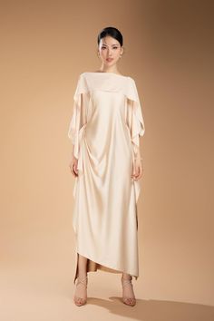 Made from a luxurious silk blend, this ankle-length dress offers a sophisticated and elegant look. Its boat neck design adds a touch of class, making it perfect for any occasion. Experience this timeless and versatile piece in your wardrobe. Length: From 125cm to 130cm Elegant Silk Gown With Draped Sleeves, Elegant Boat Neck Dress For Gala, Elegant Boat Neck Gala Dress, Elegant Boat Neck Evening Dress For Gala, Pre-draped Silk Maxi Dress For Evening, Pre-draped Maxi Length Silk Dress For Evening, Elegant Draped Silk Evening Dress, Elegant Sheath Maxi Dress For Banquet, Elegant Floor-length Satin Cocktail Dress