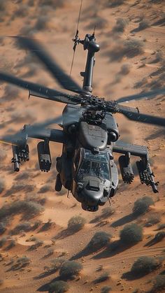 an army helicopter flying over the desert