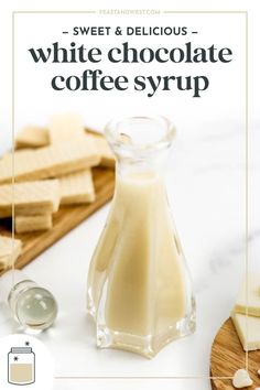 white chocolate coffee syrup in a glass bottle next to sliced cheese and crackers on a cutting board